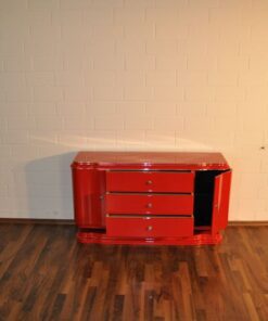 Art Deco Lowboard, red highgloss paintjob, wonderful swing doors, 3 drawers with chromehandles, chromeapplications on the foot