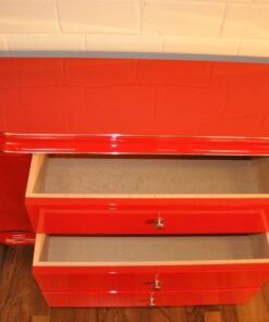 Art Deco Lowboard, red highgloss paintjob, wonderful swing doors, 3 drawers with chromehandles, chromeapplications on the foot