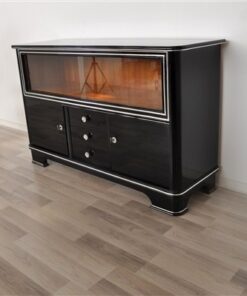 Art Deco Sideboard,black pianolacquer and chrome applications, 2 glas sliding doors infront of a big vitrine compartement, 3 drawers and 2 doors