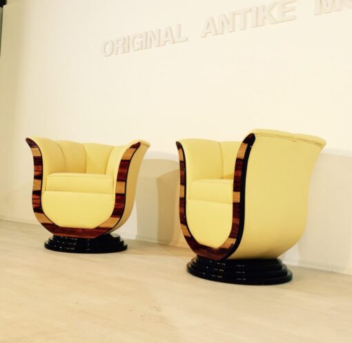 Art Deco tulip armchairs, unique form, highquality leather, macassar wood, highgloss black foot