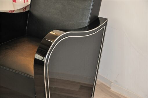 Art Deco armachair, swung armrests, black leather, rotating chromelines