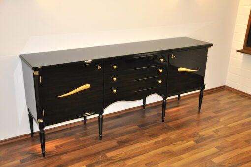 Art Deco Commode, highgloss / black, brass fittings, handpolished, 3 drawers, two shelves