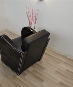 Art Deco armachair, swung armrests, black leather, rotating chromelines
