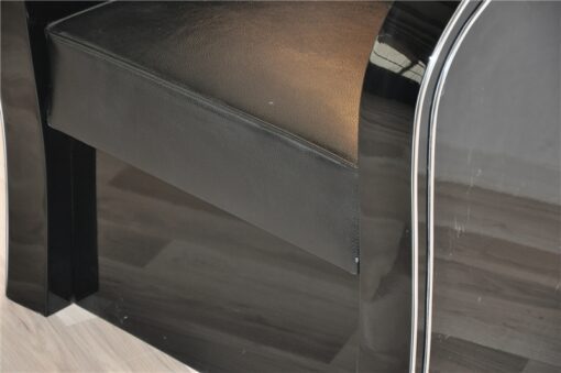 Art Deco armachair, swung armrests, black leather, rotating chromelines
