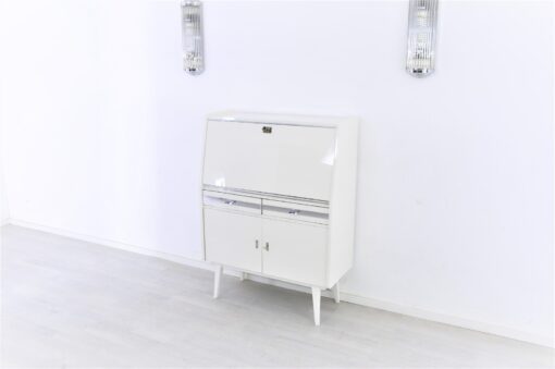 Secretaire from the 50s painted in white high gloss and decorated with chrome details inside with red leather, stunning piece, Rockabilly