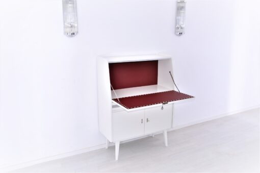 Secretaire from the 50s painted in white high gloss and decorated with chrome details inside with red leather, stunning piece, Rockabilly