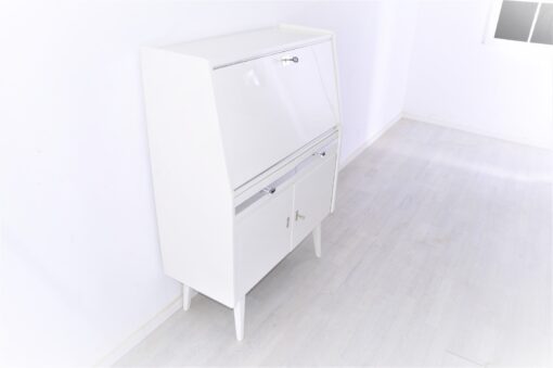 Secretaire from the 50s painted in white high gloss and decorated with chrome details inside with red leather, stunning piece, Rockabilly