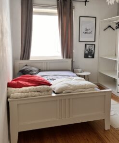 Very good wooden bed including slatted frame and mattress